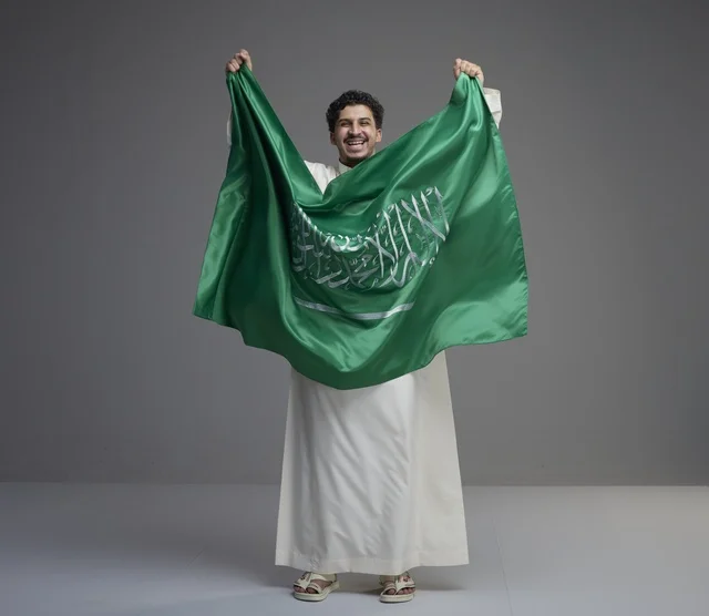 Saudi Man Holding Saudi Arabia National Flag