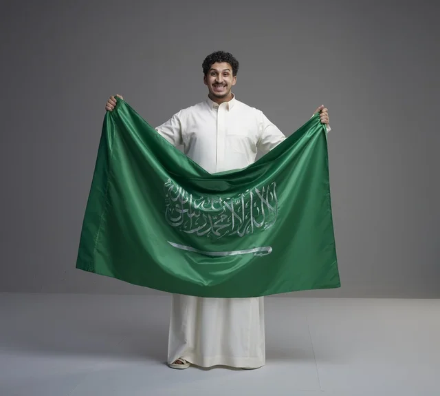 Saudi Man Holding National Flag in Studio Setting