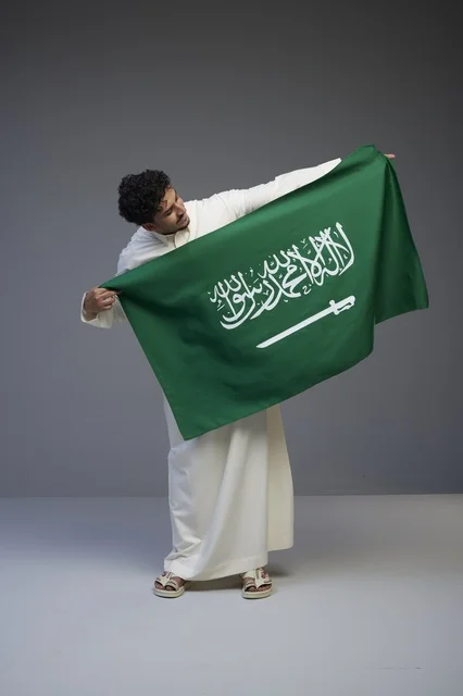Saudi Man Holding Saudi Arabian National Flag