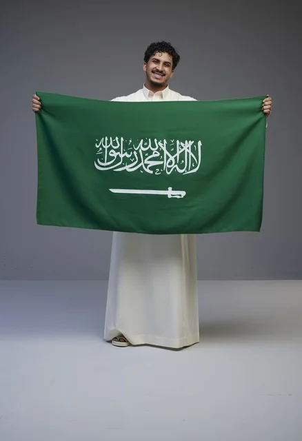 Saudi Man Holding Saudi Arabia Flag in Studio