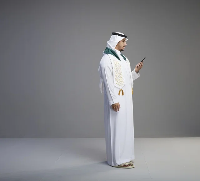 Saudi Graduate Talking on a Smartphone