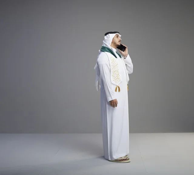 Saudi Graduate Speaking on Smartphone in Studio
