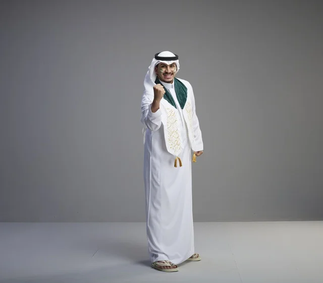 Saudi Graduate in Traditional Dress Celebrating Success