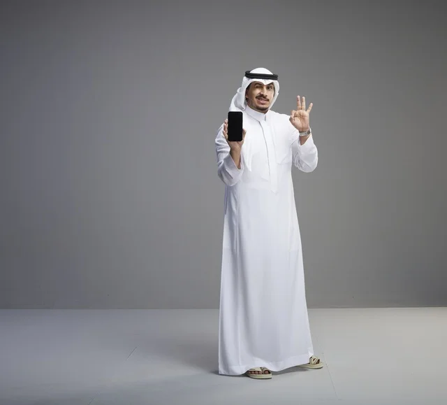 Saudi Man Holding Blank Smartphone Screen Mockup