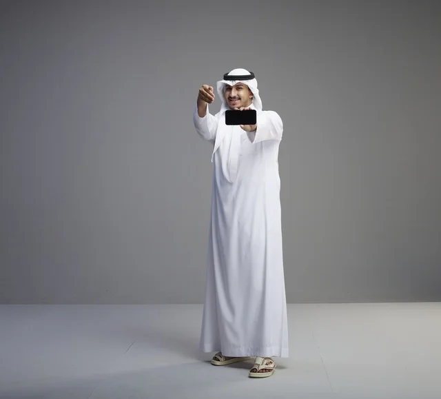 Saudi Man Holding Blank Smartphone Screen