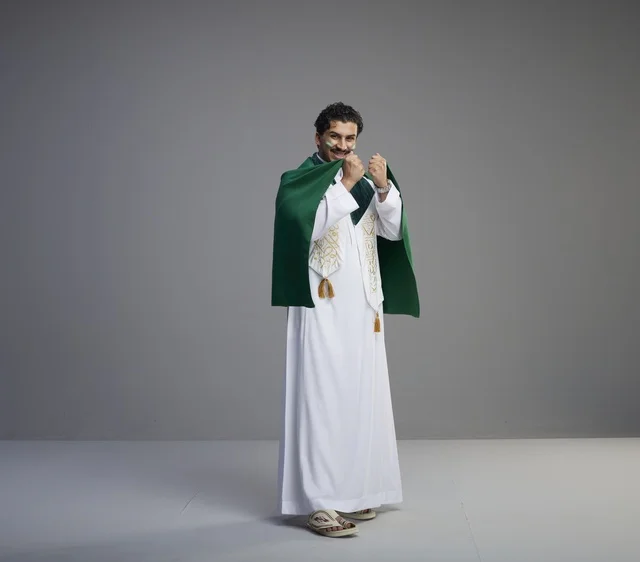 Saudi Man Wrapped in National Flag