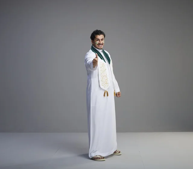 Saudi Man in Traditional Thobe Giving Thumbs Up