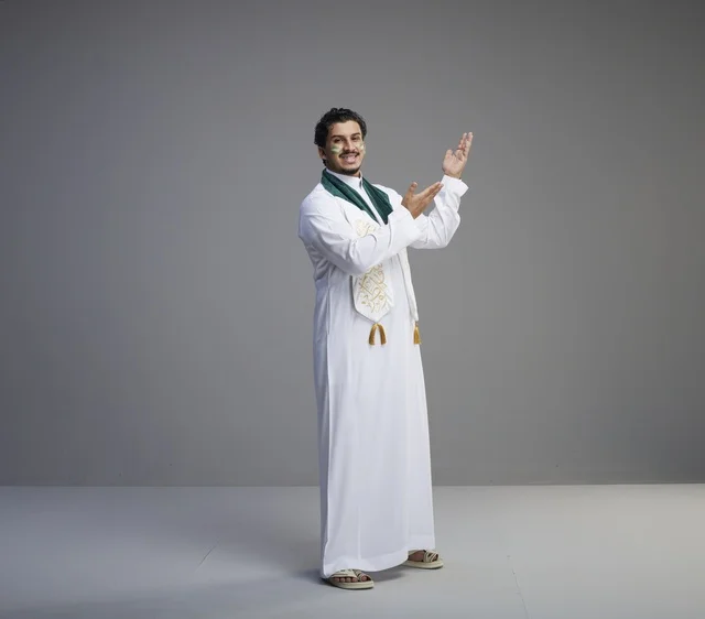 Saudi Man in National Dress Gesturing in Studio