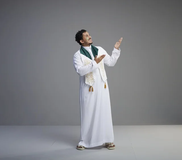 Saudi Man in National Dress Gesturing in Studio