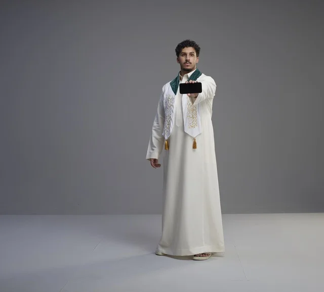 Saudi Man Holding Smartphone Blank Screen Full Length