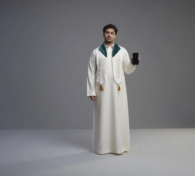Saudi Man Holding Smartphone with Blank Screen