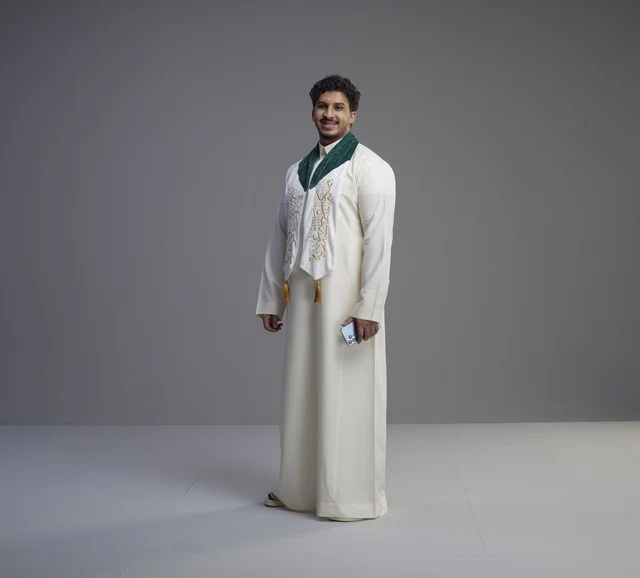 Saudi Man in National Scarf Holding Phone in Studio
