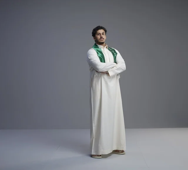 Saudi Man in Traditional Thobe and Green National Scarf