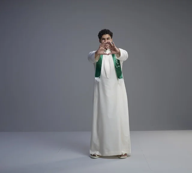 Saudi Man in National Scarf Making Heart Sign