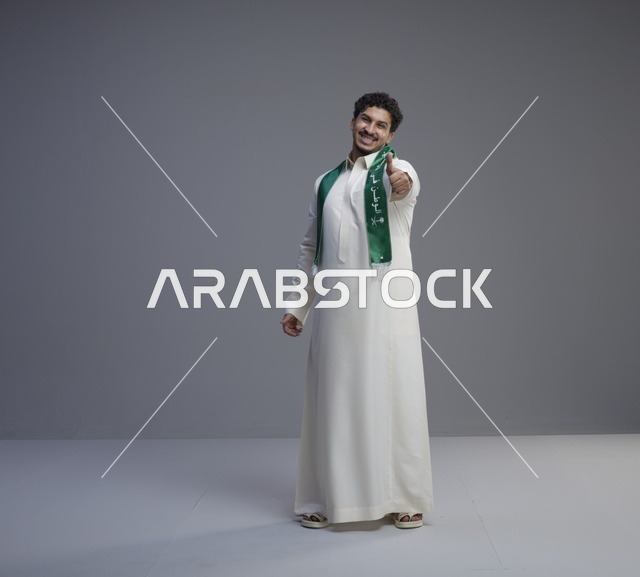 Saudi Man in Thobe with National Scarf Thumbs Up