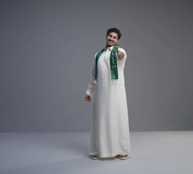 Saudi Man in Thobe with National Scarf Thumbs Up