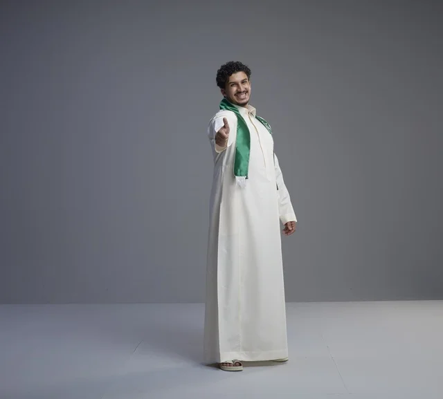 Saudi Man in Thobe with National Scarf Handshake