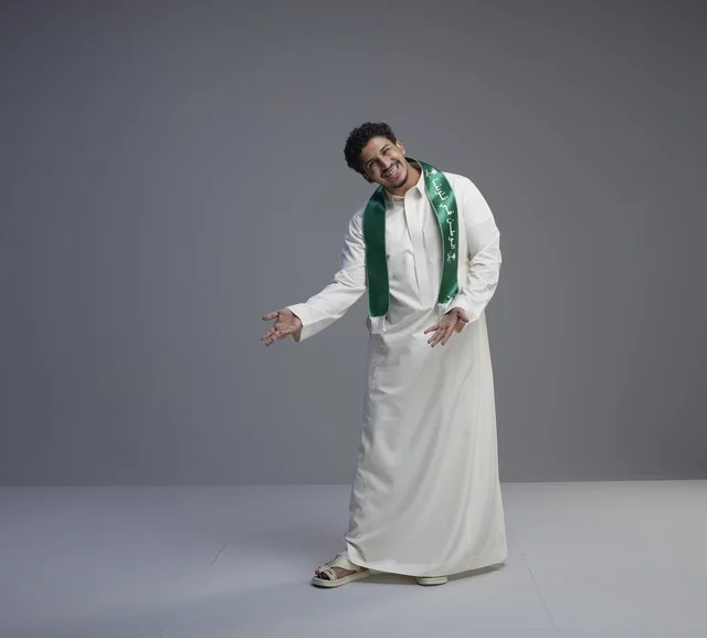 Saudi Man in Traditional Thobe and National Green Scarf
