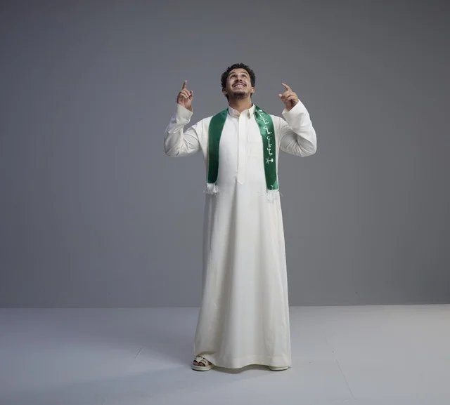 Saudi Man in Thobe with National Scarf Pointing Up