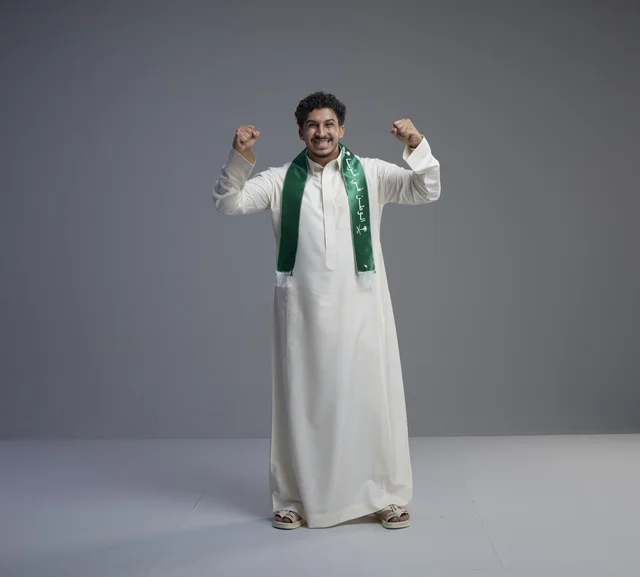Saudi Man Celebrating National Day in Green Scarf