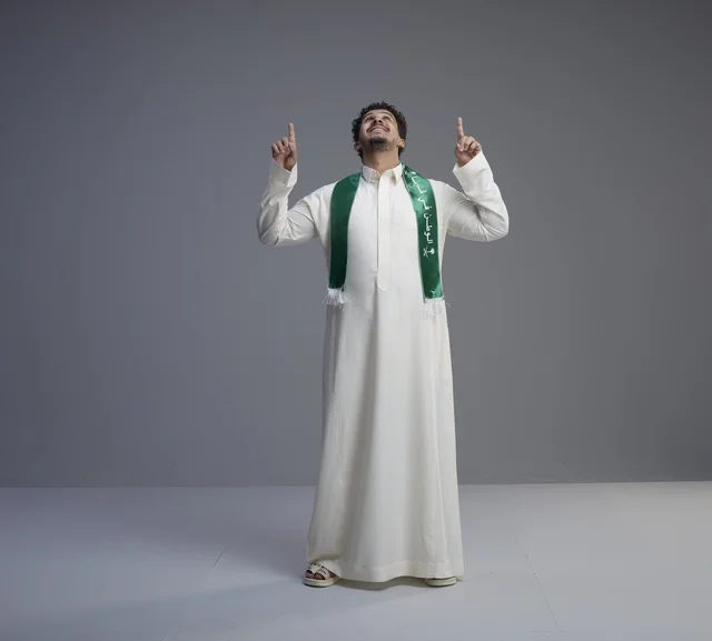 Saudi Man in National Scarf Pointing Upwards
