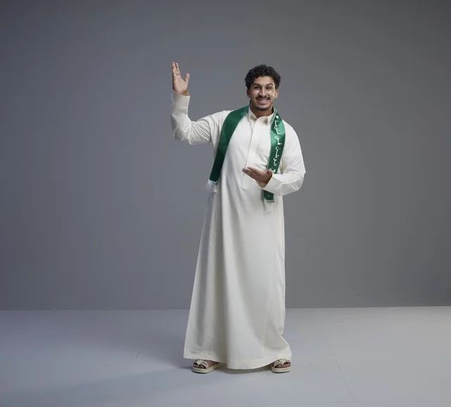 Saudi Man in National Scarf Gesturing on Grey Background