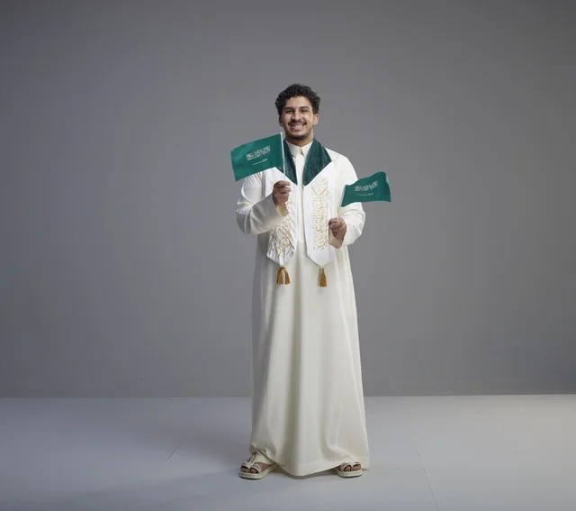 Saudi Graduate Celebrating with National Flag