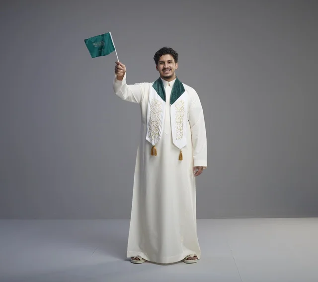 Saudi Graduate with National Flag in Studio