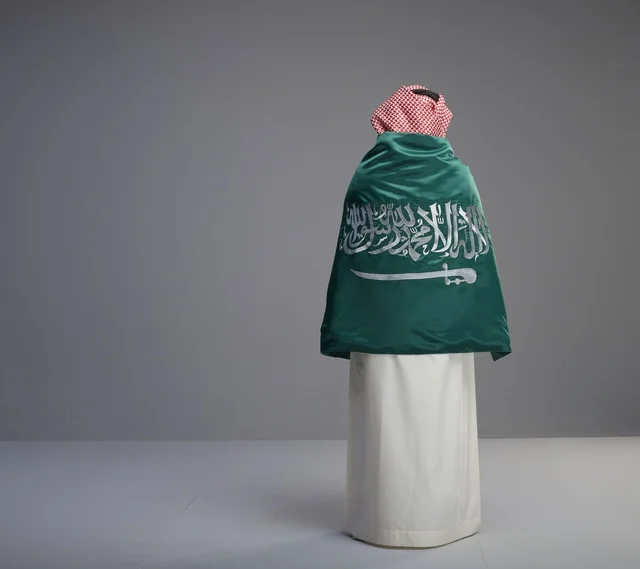 Saudi Man Wrapped in Saudi Arabia Flag in Studio