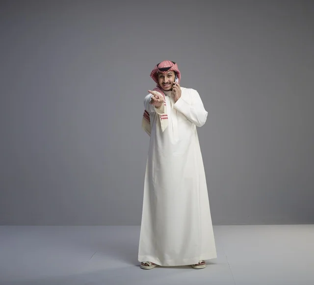Saudi Man Talking on Smartphone in Studio