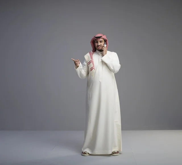 Saudi Man Talking on Smartphone in Studio