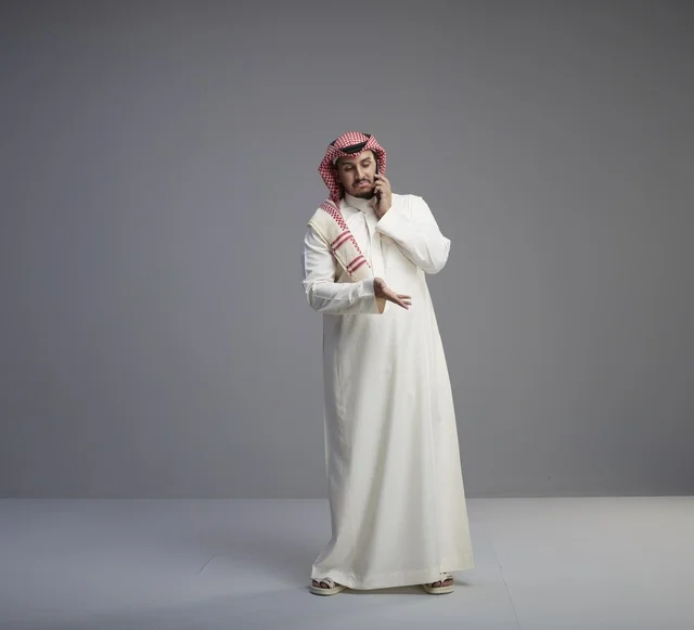 Saudi Man Talking on Smartphone in Studio