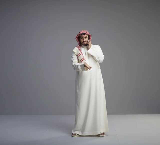 Saudi Man Talking on Smartphone in Studio