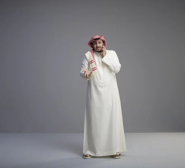 Saudi Man Talking on Smartphone in Studio