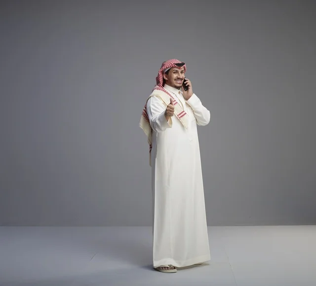 Saudi Man Using Smartphone Thumbs Up Studio Background