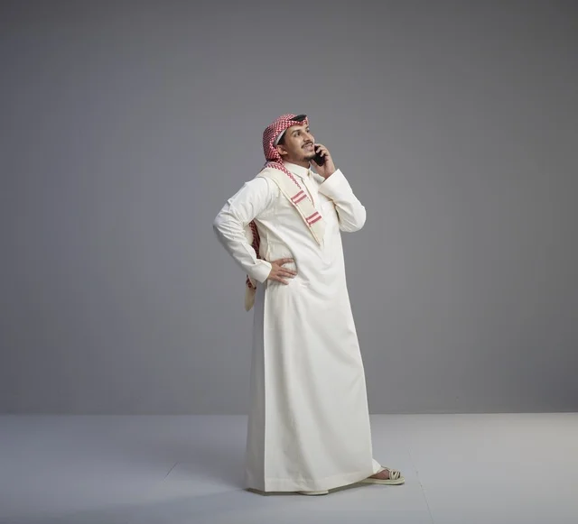 Saudi Man Talking on Smartphone in Studio