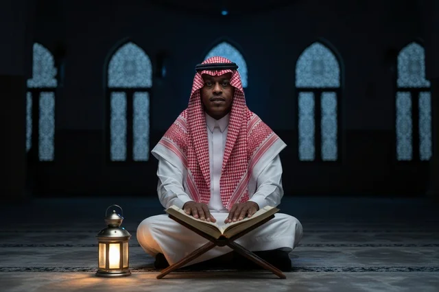 Saudi Man Reading Quran in Mosque with Lantern
