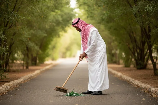 Saudi Man Sweeping Broken Glass in Public Park