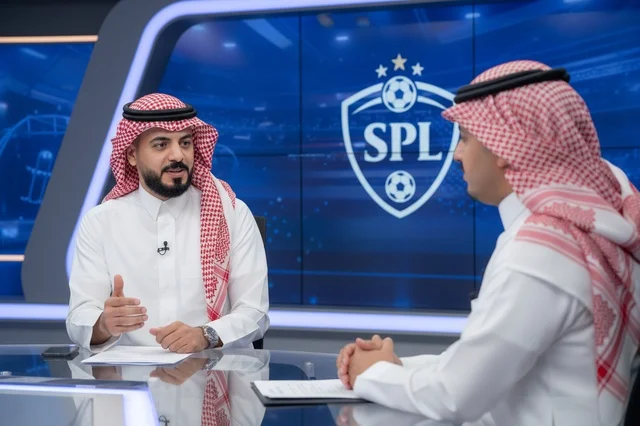 Saudi Men in Traditional Dress in TV Sports Studio