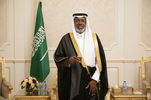 Saudi Man in Traditional Bisht Holding Arabic Coffee