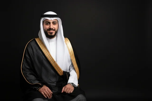 Saudi Man in Traditional Black Bisht and White Thobe