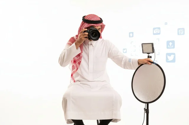 Saudi Male Photographer in Studio with Camera and Reflector
