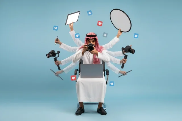 Saudi Man Multitasking with Digital Media Equipment