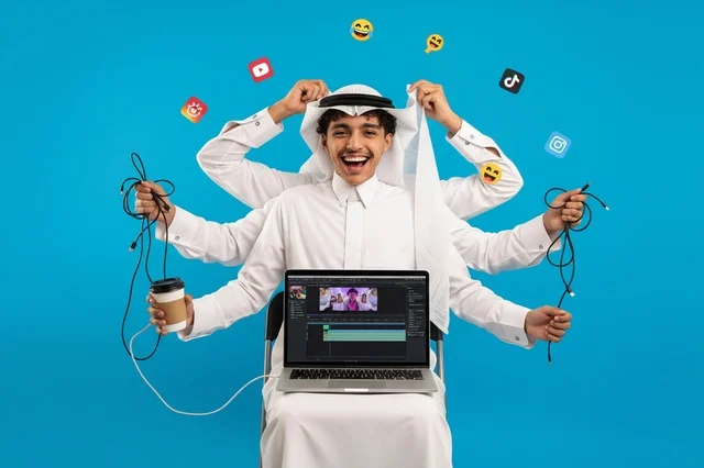 Saudi Content Creator Multitasking on Laptop Blue Background