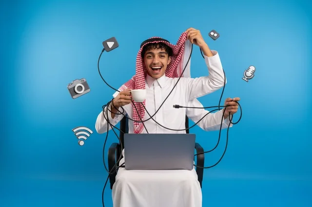 Saudi Man Multitasking with Multiple Arms and Laptop