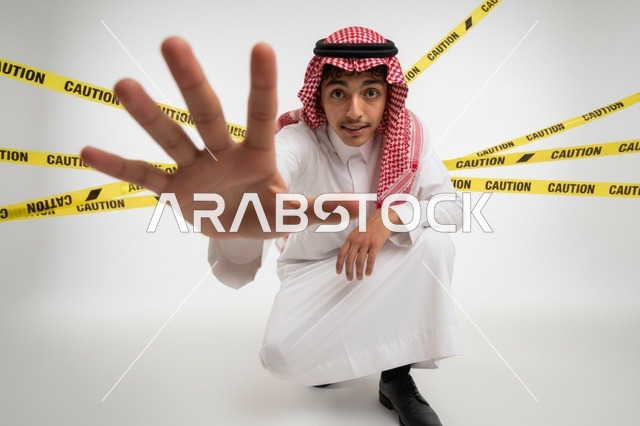 Saudi Man with Stop Gesture and Caution Tape