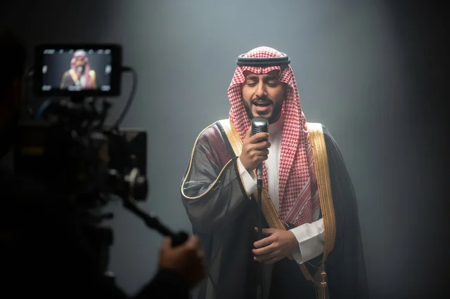 Saudi Man Singing in Traditional Bisht in Recording Studio