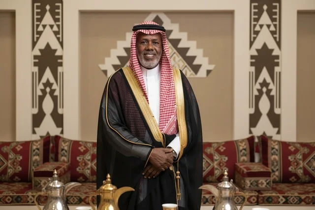 Senior Saudi Man in Traditional Majlis Wearing Bisht