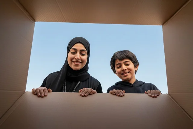 Saudi Mother and Son Unboxing Package Outdoors