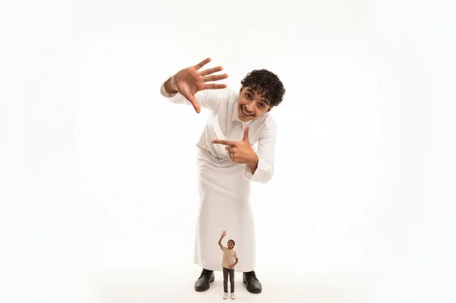 Saudi Man in White Thobe with Miniature Figure